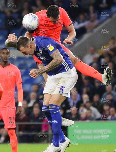 210819 - Cardiff City v Huddersfield Town, Sky Bet Championship - Tommy Elphick of Huddersfield Town gets above Aden Flint of Cardiff City to head the ball