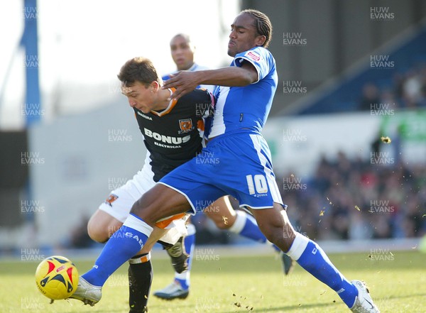 180206 Cardiff City v Hull City Cardiff's Cameron Jerome battles with Mark Noble for the ball 