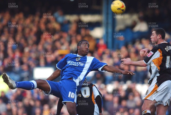 180206 - Championship Football - Cardiff City v Hull City Cardiff's Cameron Jerome beats Alton Thelwell and Damien Delaney to a high ball 