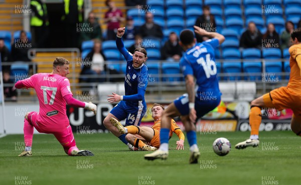 060424 - Cardiff City v Hull City, EFL Sky Bet Championship - Josh Bowler of Cardiff City is tackled by Matty Jacob of Hull City as he crosses the ball