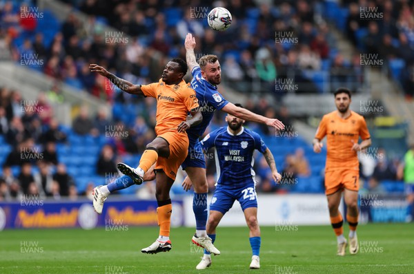 060424 - Cardiff City v Hull City, EFL Sky Bet Championship - Joe Ralls of Cardiff City and Jean Michael Seri of Hull City compete for the ball