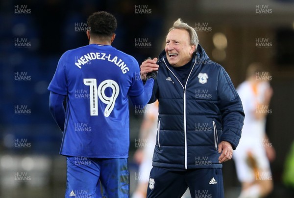 161217 - Cardiff City v Hull City - SkyBet Championship - Neil Warnock, Manager of Cardiff City celebrates with Nathaniel Mendez-Laing of Cardiff City at full time