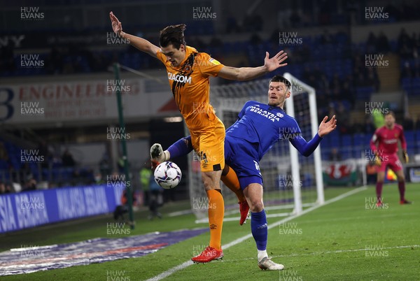 241121 - Cardiff City v Hull City - SkyBet Championship - Jacob Greaves of Hull City is challenged by Kieffer Moore of Cardiff City