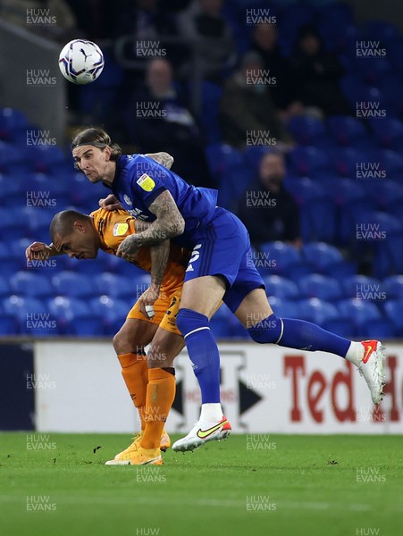 241121 - Cardiff City v Hull City - SkyBet Championship - Josh Magennis of Hull City is challenged by Aden Flint of Cardiff City