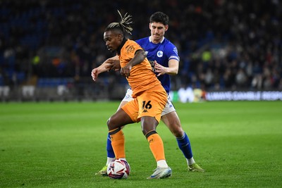 250225 - Cardiff City v Hull City - Sky Bet Championship - Callum O'dowda of Cardiff City is challenged by Lincoln BRA of Hull City