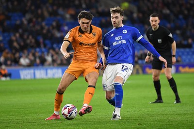 250225 - Cardiff City v Hull City - Sky Bet Championship - Calum Chambers of Cardiff City is challenged by Lewis Coyle of Hull City