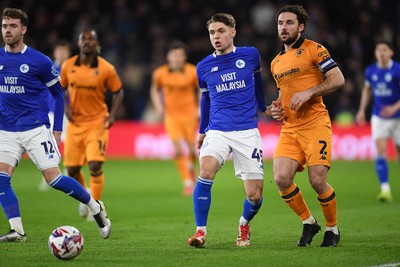 250225 - Cardiff City v Hull City - Sky Bet Championship - Cian Ashford of Cardiff City is challenged by Lewis Coyle of Hull City