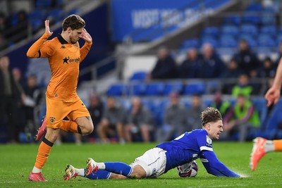 250225 - Cardiff City v Hull City - Sky Bet Championship - Cian Ashford of Cardiff City is tackled by Regan Slater of Hull City just outside the box