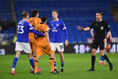 250225 - Cardiff City v Hull City - Sky Bet Championship - Things heat up between Sivert Mannsverk of Cardiff City and Matt Crooks of Hull City and both receive a yellow card