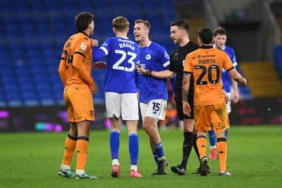 250225 - Cardiff City v Hull City - Sky Bet Championship - Things heat up between Sivert Mannsverk of Cardiff City and Matt Crooks of Hull City and both receive a yellow card