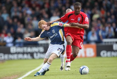 25.04.09 - Cardiff City v Ipswich Town, Coca Cola Championship -  Cardiff's Chris Burke tangles with Ipswich's Kevin Lisbie  