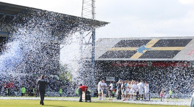25.04.09 - Cardiff City v Ipswich Town, Coca Cola Championship -  Cardiff City players and their families are showered in paper tape as they gather on the pitch at the end of the final league match at Ninian Park 