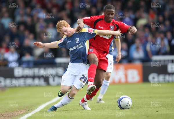 25.04.09 - Cardiff City v Ipswich Town, Coca Cola Championship -  Cardiff's Chris Burke tangles with Ipswich's Kevin Lisbie  
