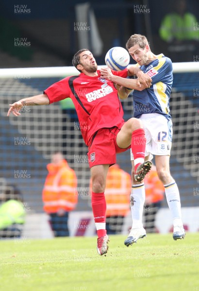 25.04.09 - Cardiff City v Ipswich Town, Coca Cola Championship -  Cardiff's Roger Johnson and Ipswich's Pablo Counago  compete for the ball 