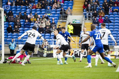 090324 - Cardiff City v Ipswich Town - Sky Bet Championship - Kieffer Moore of Ipswich Town clears the ball off the line