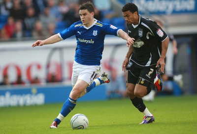 15.10.11 -  Cardiff City v Ipswich Town, npower Championship -  Cardiff's Craig Conway holds off Ipswich's Carlos Edwards  