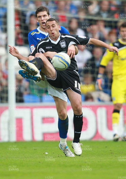 15.10.11 -  Cardiff City v Ipswich Town, npower Championship -  Ipswich's Michael Chopra is held by Cardiff's Mark Hudson 