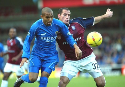 291103 - Cardiff City v Ipswich Town - Cardiff's Danny Gabbidon is put under pressure by Shefki Kuqi