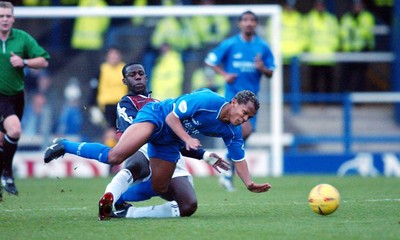 291103 - Cardiff City v Ipswich Town - Cardiff's Robert Earnshaw is felled by Chris Bart-Williams