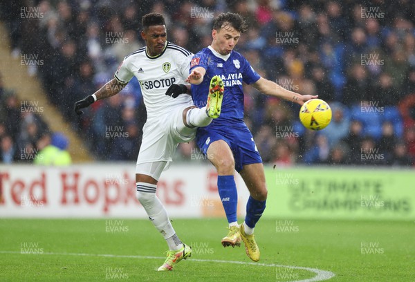 080123 - Cardiff City v Leeds United, Emirates FA Cup Third Round - Mark Harris of Cardiff City and Junior Firpo of Leeds United compete for the ball