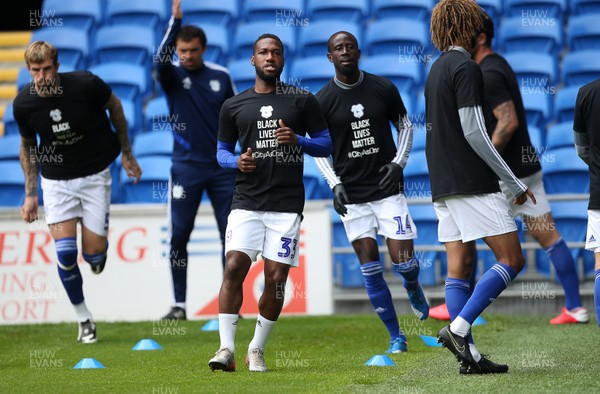 210620 - Cardiff City v Leeds United - SkyBet Championship - Junior Hoilett and Albert Adomah of Cardiff City during the warm up wearing the Black Lives Matter t-shirts