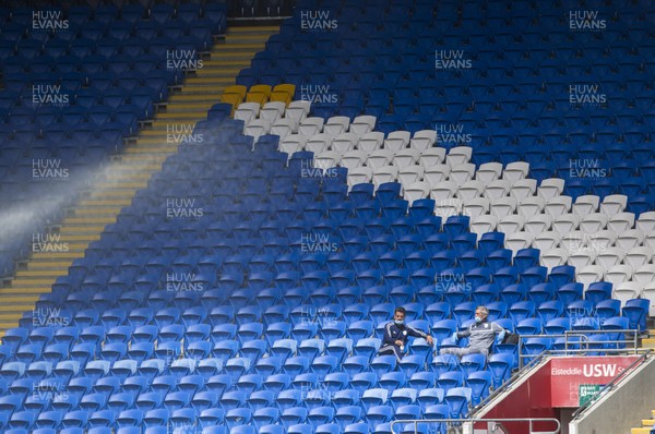 210620 - Cardiff City v Leeds United - SkyBet Championship - Cardiff staff sit in the empty stands