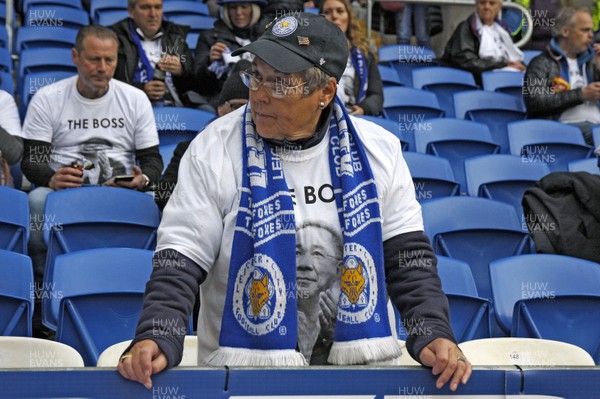 031118 - Cardiff City v Leicester City, Premier League - A Leicester City fan wears a t-shirt in memory of Leicester City owner Vichai Srivaddhanaprabha who died when his helicopter crashed after taking off from the King Power Stadium last weekend
