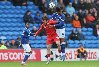 041025 - Cardiff City v Leyton Orient, EFL Sky Bet League 1 - Aaron Connolly of Leyton Orient and Gabiel Osho of Cardiff City compete for the ball