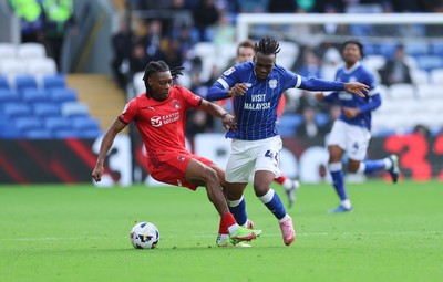 041025 - Cardiff City v Leyton Orient, EFL Sky Bet League 1 - Ronan Kpakio of Cardiff City and Tayo Adaramola of Leyton Orient compete for the ball