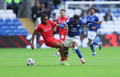 041025 - Cardiff City v Leyton Orient, EFL Sky Bet League 1 - Ronan Kpakio of Cardiff City and Tayo Adaramola of Leyton Orient compete for the ball