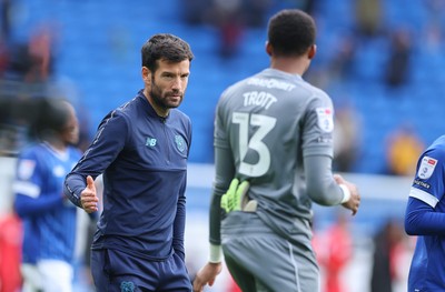 041025 - Cardiff City v Leyton Orient, EFL Sky Bet League 1 - Cardiff City head coach Brian Barry-Murphy with Cardiff City goalkeeper Nathan Trott at the end of the match
