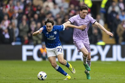 070326 - Cardiff City v Lincoln City - Sky Bet League 1 - Joel Colwill of Cardiff City in action against Adam Reach of Lincoln City