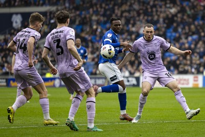 070326 - Cardiff City v Lincoln City - Sky Bet League 1 - Ronan Kpakio of Cardiff City in action against Ben House of Lincoln City