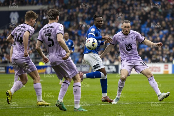 070326 - Cardiff City v Lincoln City - Sky Bet League 1 - Ronan Kpakio of Cardiff City in action against Ben House of Lincoln City