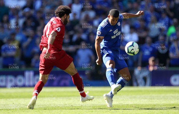 210419 - Cardiff City v Liverpool FC - Premier League - Mohamed Salah of Liverpool is tackled by Lee Peltier of Cardiff City