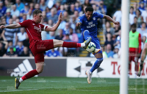 210419 - Cardiff City v Liverpool FC - Premier League - Nathaniel Mendez-Laing of Cardiff City is tackled by Jordan Henderson of Liverpool
