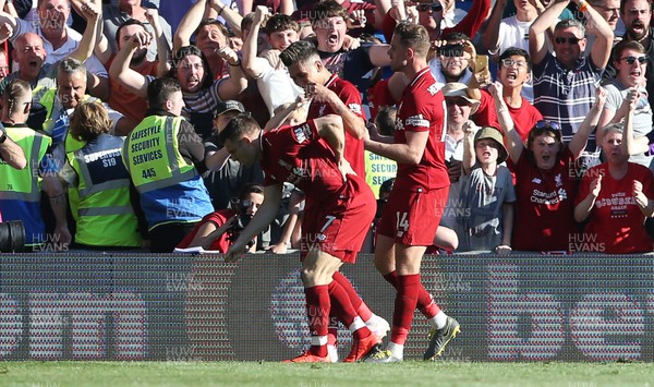 210419 - Cardiff City v Liverpool FC - Premier League - James Milner of Liverpool celebrates scoring a goal with team mates