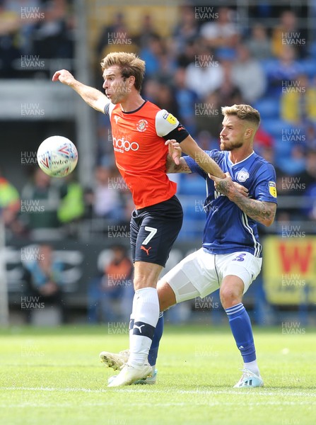 100819 - Cardiff City v Luton Town, Sky Bet Championship - Callum McManaman of Luton Town and Joe Bennett of Cardiff City compete for the ball