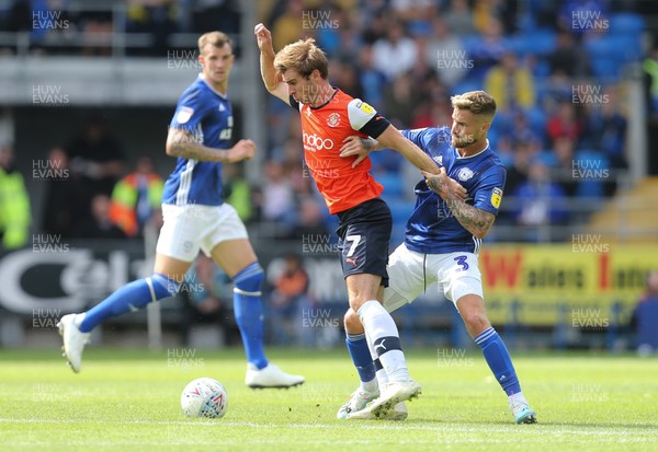 100819 - Cardiff City v Luton Town, Sky Bet Championship - Callum McManaman of Luton Town and Joe Bennett of Cardiff City compete for the ball
