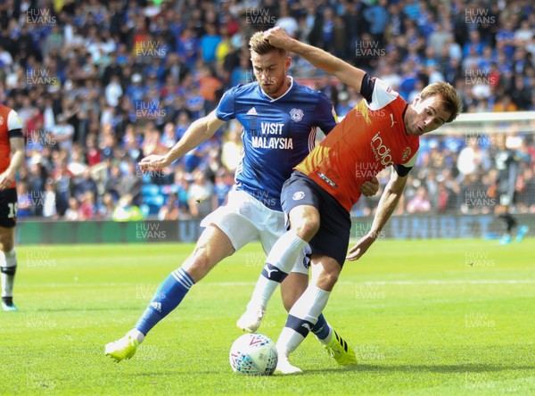 100819 - Cardiff City v Luton Town, Sky Bet Championship - Joe Ralls of Cardiff City and Callum McManaman of Luton Town compete for the ball