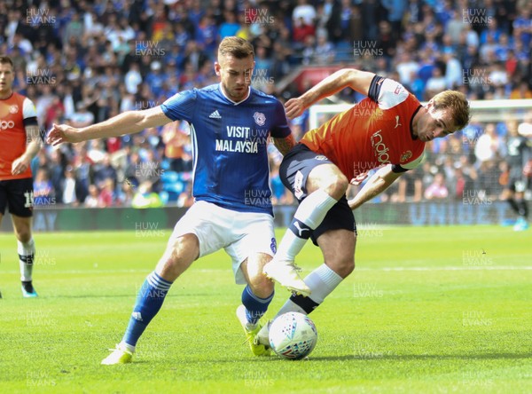 100819 - Cardiff City v Luton Town, Sky Bet Championship - Joe Ralls of Cardiff City and Callum McManaman of Luton Town compete for the ball