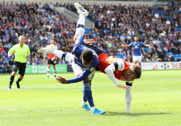 100819 - Cardiff City v Luton Town, Sky Bet Championship - Martin Cranie of Luton Town is upended as he challenges Josh Murphy of Cardiff City for the ball