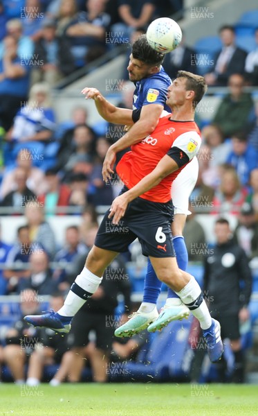 100819 - Cardiff City v Luton Town, Sky Bet Championship - Callum Paterson of Cardiff City gets above Matty Pearson of Luton Town to head the ball