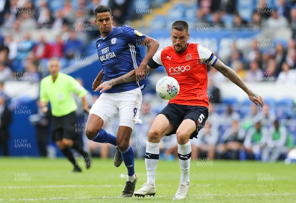 100819 - Cardiff City v Luton Town, Sky Bet Championship - Robert Glatzel of Cardiff City and Sonny Bradley of Luton Town compete for the ball