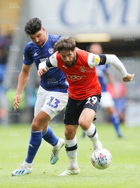 100819 - Cardiff City v Luton Town, Sky Bet Championship - Callum Paterson of Cardiff City and Jacob Butterfield of Luton Town compete for the ball