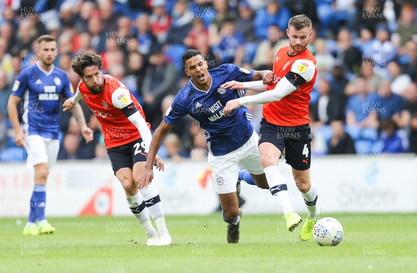 100819 - Cardiff City v Luton Town, Sky Bet Championship - Robert Glatzel of Cardiff City and Ryan Tunnicliffe of Luton Town compete for the ball