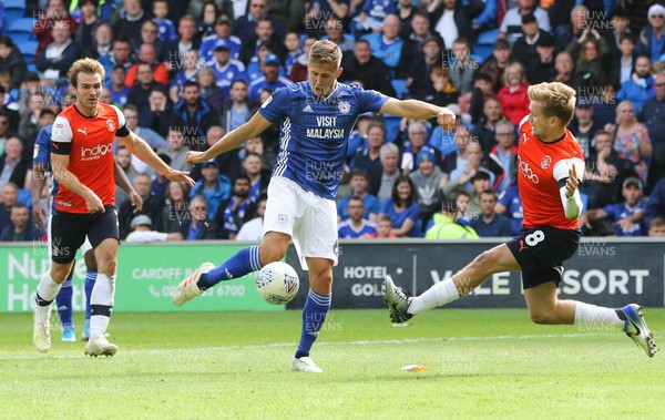 100819 - Cardiff City v Luton Town, Sky Bet Championship - Will Vaulks of Cardiff City fires a shot at goal as Luke Berry of Luton Town closes in