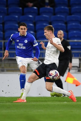 110325 - Cardiff City v Luton Town - Sky Bet Championship - Yousef Salech of Cardiff City is challenged by Mark McGuinness of Luton Town