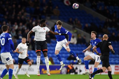 110325 - Cardiff City v Luton Town - Sky Bet Championship - Calum Chambers of Cardiff City is challenged by Elijah Adebayo of Luton Town