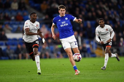 110325 - Cardiff City v Luton Town - Sky Bet Championship - Rubin Colwill of Cardiff City is challenged by Isaiah Jones of Luton Town